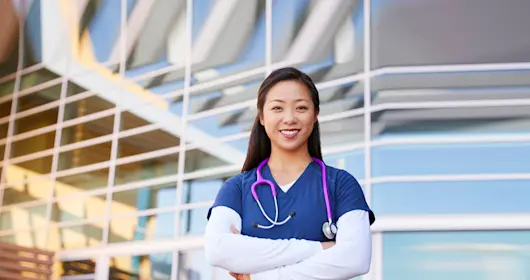 female healthcare worker with arms crossed