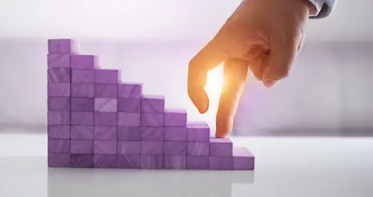 Fingers walking up purple steps