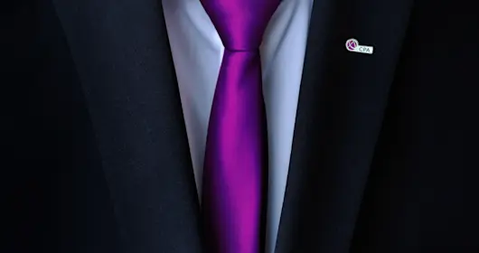 close up of suit with purple tie